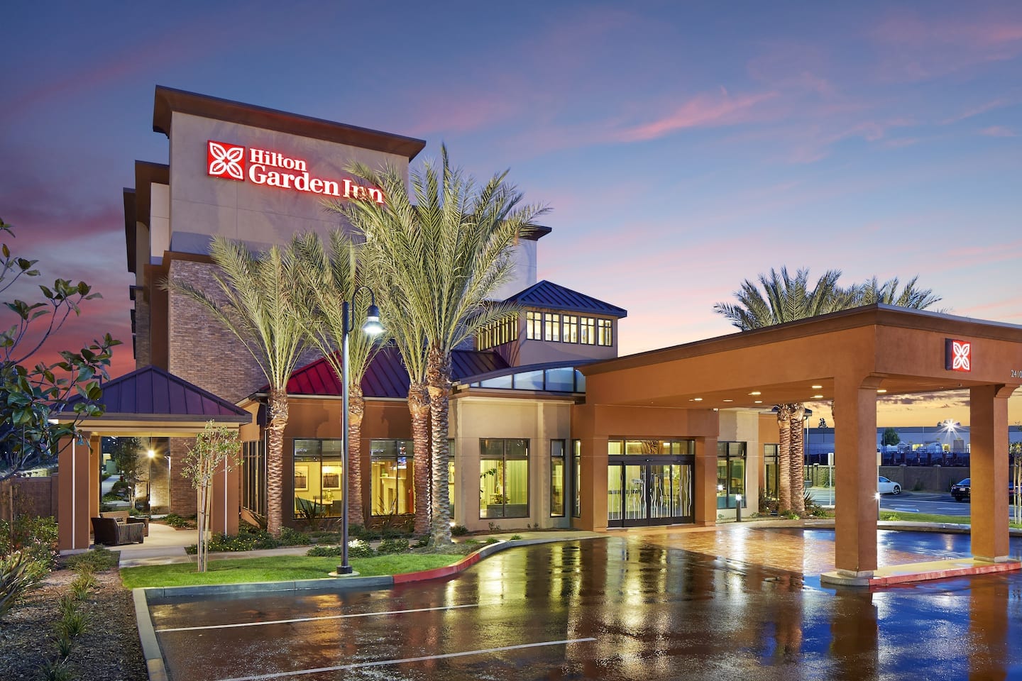Hilton Garden Inn Los Angeles/Redondo Beach exterior and entrance at dusk on Marine Avenue